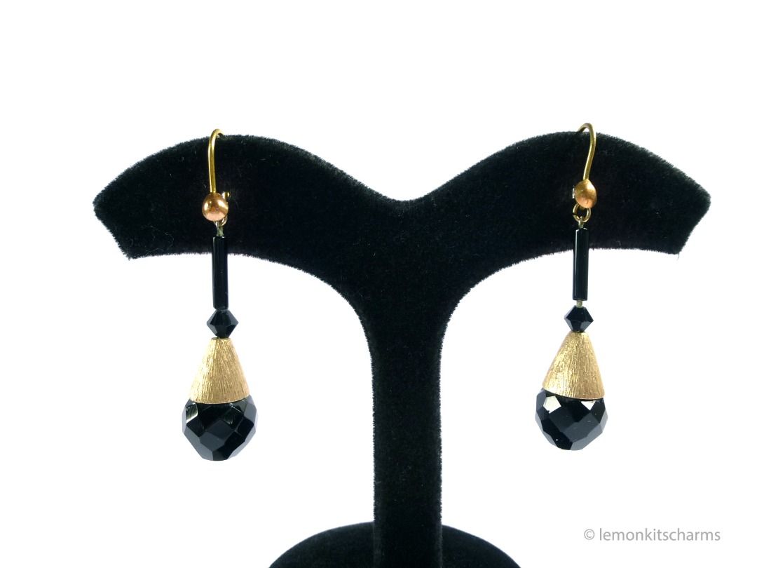 Vintage 1960s Black Glass Earrings with Antique Hooks, er2658-ci (Category: Earrings) located in Singapore. Submitted by lemonkitscharms (Listing ID 1377932817, Image 2). Description: Vintage 1950s - 1960s Black Glass Dangle Earrings with antique hooks. Very good condition, minor aging. The unused hooks are antiques from the 1910s, they are thicker than the hooks we have today. The 60s dangles were originally on clips, then haphazardly soldered i