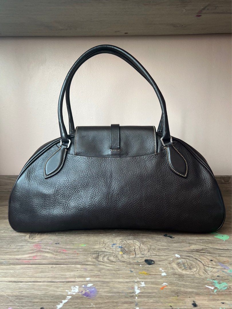 Vintage Prada Leather Boston Bag (Category: Luxury Bags & Wallets) located in Manila. Submitted by ladybagmnl (Listing ID 1377784261, Image 2). Description: Authentic vintage Prada Boston bag in thick pebbled leather with contrast stitching and silver-tone hardware. Deep brown (almost black) color. Rare, structured, and understated—perfect for quiet luxury lovers. 👜 100% AUTHENTIC 👜 Full leather, made in Italy 👜 With original Prada dustbag, cl