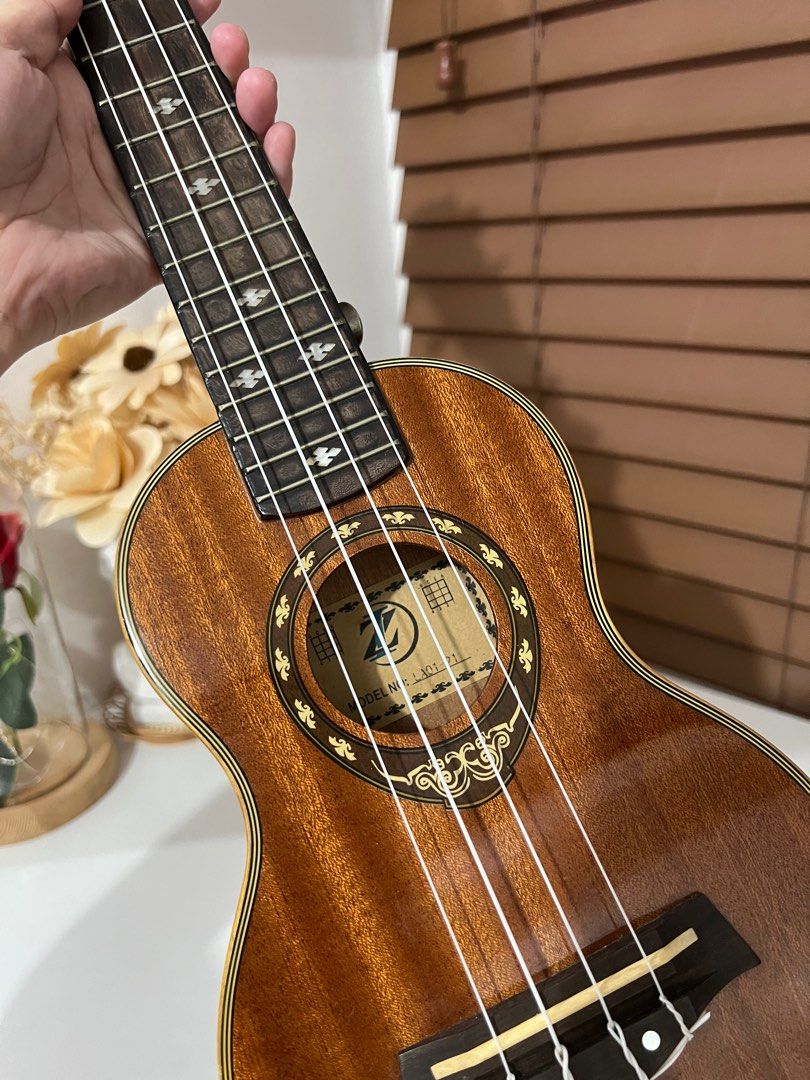 ZI Premium 21” Soprano Ukelele in Wood (Category: Musical Instruments) located in Bulacan. Submitted by modamuze (Listing ID 1377857471, Image 1). Description: 21 inches with free pick & travel bag issue: with dent .