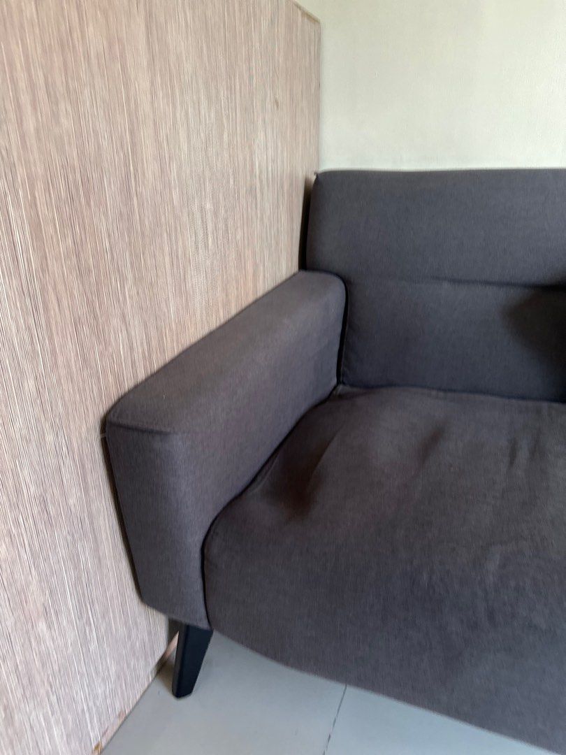 Gray sofa bed (Category: Sofas) located in Cavite. Submitted by prelovedbymaeve (Listing ID 1372863656, Image 2). Description: Flaw: may nakalubog na sa gilid.