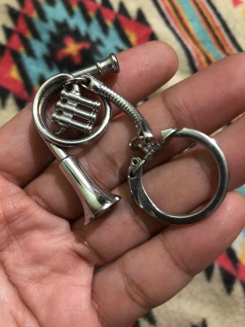 Mini trumpet metal charm (Category: Musical Instruments) located in Quezon City. Submitted by markgolveo (Listing ID 1372915770, Image 2). Description: Mini trumpet metal charm Working Squeaks when played upon blowing at the horn .