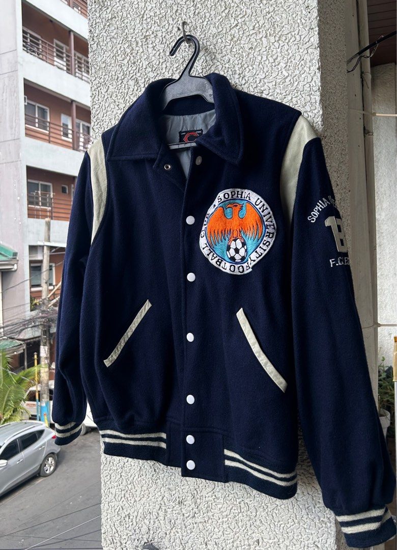 Varsity vintage university jacket navy blue (Category: Coats, Jackets and Outerwear) located in Manila. Submitted by mango.supply (Listing ID 1372954422, Image 1). Description: Varsity jacket navy blue with leather and embroidered details Large Price plus shipping fee.