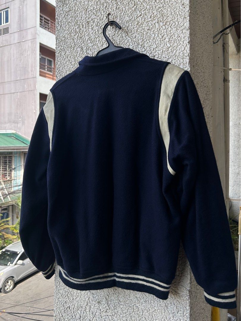 Varsity vintage university jacket navy blue (Category: Coats, Jackets and Outerwear) located in Manila. Submitted by mango.supply (Listing ID 1372954422, Image 2). Description: Varsity jacket navy blue with leather and embroidered details Large Price plus shipping fee.