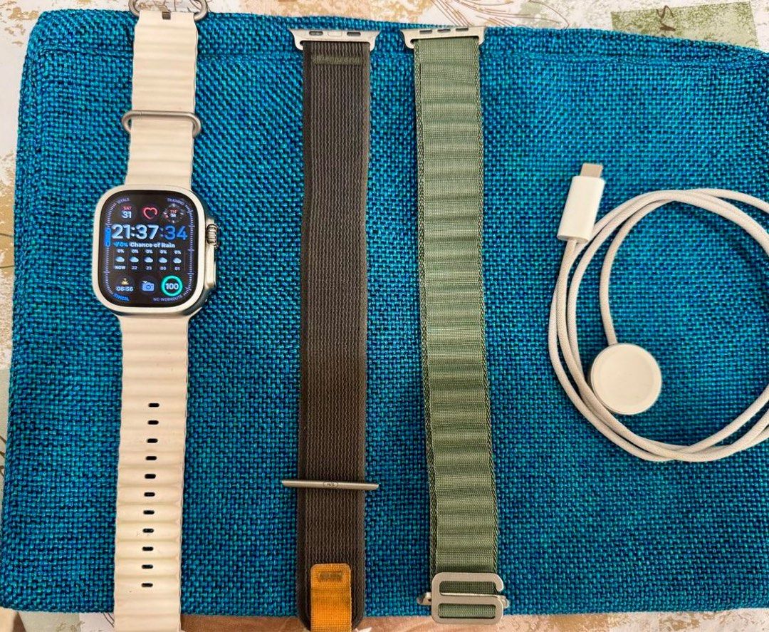 Apple Watch Ultra (Category: Wearables & Smart Watches) located in Singapore. Submitted by mysticblossom11 (Listing ID 1373141716, Image 2). Description: Apple Watch Ultra, 49 mm + ocean band white (original apple) + sports band grey (original Apple) + tempered glass on dial + charging cable .