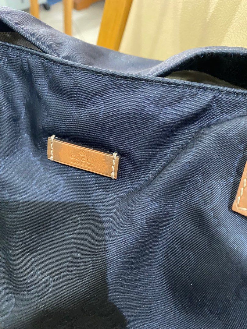 Gucci black nylon tote bag (Category: Luxury Bags & Wallets) located in Butuan. Submitted by natalday (Listing ID 1373097506, Image 2). Description: large size width - 17 inches height - 15 inches.