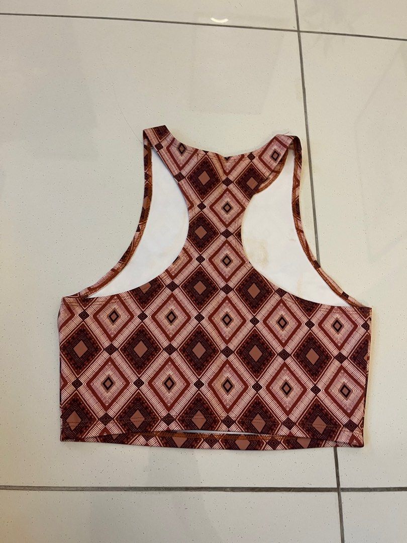 Patterned Top (Category: Sleeveless) located in Johor Bahru. Submitted by amberr257 (Listing ID 1373080683, Image 3). Description: Fitted racer top with geometric patterns Has stains on the inside (from keeping in storage for long time) as shown in pictures, not visible when wearing.