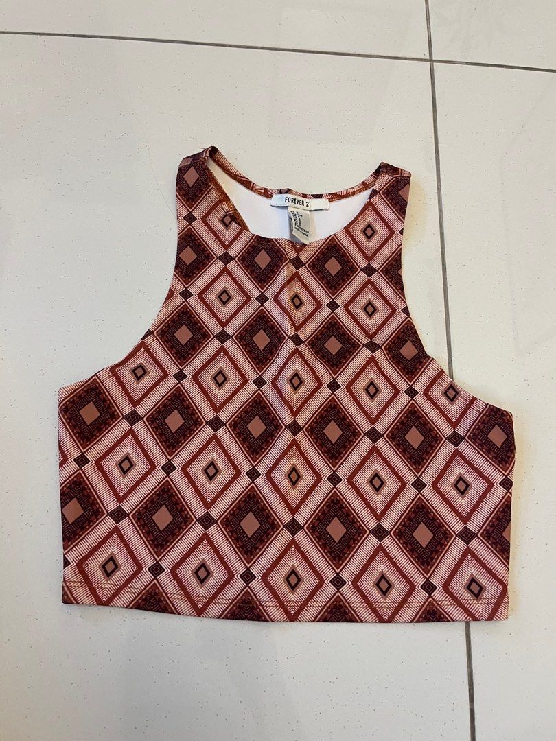 Patterned Top (Category: Sleeveless) located in Johor Bahru. Submitted by amberr257 (Listing ID 1373080683, Image 1). Description: Fitted racer top with geometric patterns Has stains on the inside (from keeping in storage for long time) as shown in pictures, not visible when wearing.