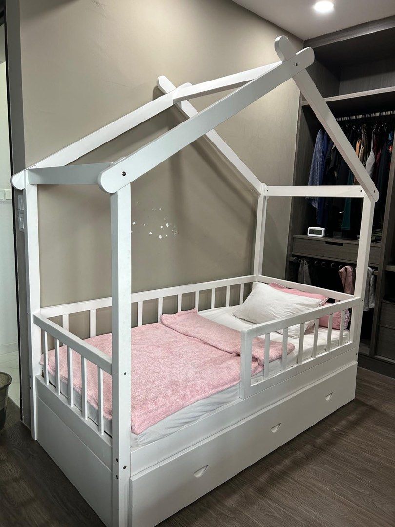 Solid wood white Children Bed House Frame + mattress + pull out (Category: Childrens' Beds) located in Singapore. Submitted by stxe23 (Listing ID 1373109167, Image 3). Description: Solid wood. Self collection at my place on June 11-14 Please dismantle yourself. Can sleep 2 kids (1 on top, 1 below) Include pull out bed with wheel Include 1 mattress (in good condition) ******** You can top up $80 for 1 ikea brand new mattress (wrap in plastic).