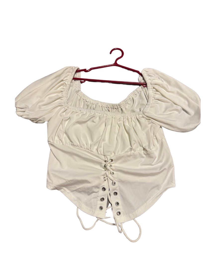 white tie front detail corset like top (Category: Blouses) located in Pasig City. Submitted by araluvsu (Listing ID 1373209126, Image 1). Description: bought on shoppee best fit s-m never worn mop: gcash mod: same day, jnt, lbc.