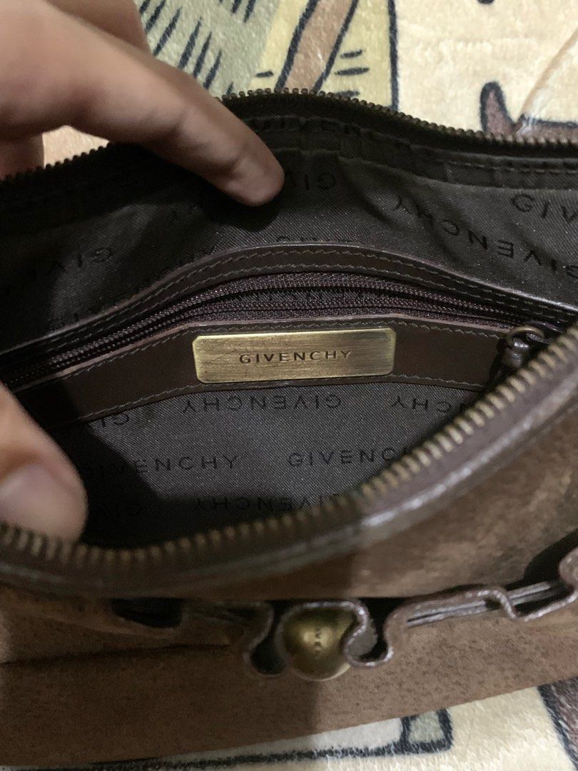Authentic Givenchy Suede Leather Shoulder Bag (Category: Luxury Bags & Wallets) located in Manila. Submitted by girlwithatattoo (Listing ID 1373342883, Image 2). Description: The exterior is Suede Has Gold Tone Hardware Drawstring (leather) tassel accents Vintage & Preloved Price is negotiable ‼️ Can do meet up around lrt line 2, around sm manila or city hall, lalamove/grab, or J&T. .