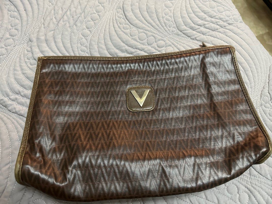 MARIO VALENTINO Clutch, Brown (Category: Clutches) located in Manila. Submitted by hey_ole1 (Listing ID 1373342304, Image 1). Description: Decluttering personal items Authentic, tarnished hardware (V) but still pretty, clean inside Bought preloved fr Japan Rfs: need more closet space Payment first thru Gcash BDO BPI Shipping fee c/o buyer thru LMove Prefers Metro Manila buyers 📍Marikina City.