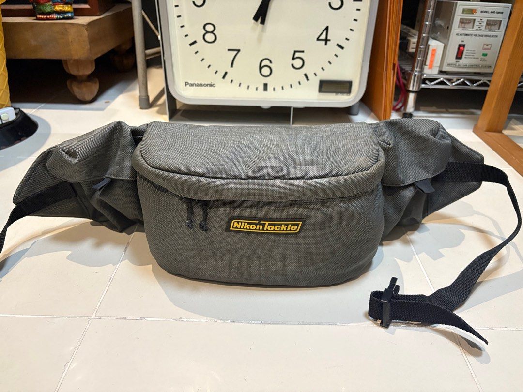 Nikon Tackle Padded Camera Waist Bag (Category: Camera Bags & Carriers) located in Dasmarinas. Submitted by 8ocho8 (Listing ID 1373307971, Image 1). Description: Vintage Original Nikon Tackle Camera Bag - in very good condition, only needs cleaning - heavily padded - with 2 external pockets for other camera accessories - heavy duty Nifco buckle - Japan sourced - last photo shows with DSLR camera fitted for size reference. Measurements of main com