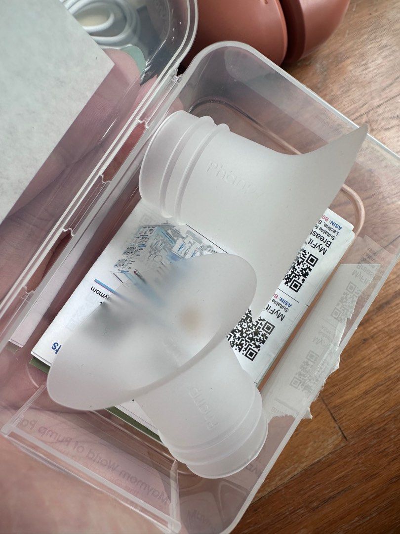 Phanpy Wearable Electric Breast Pump (Category: Breastfeeding & Bottle Feeding) located in Singapore. Submitted by tellyouwhat (Listing ID 1373255011, Image 3). Description: This is my spare set of the same wearable electric breast pump, as the initial set was used for many years; had this as standby. Comes with: - Box - Manuals - Original charging cables (unused) - Milk containers with all original pump parts intact - 2 x electric pumps - FOC: B