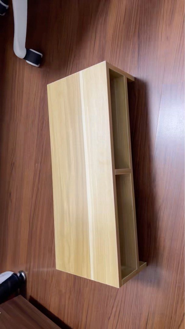 Wooden Monitor Stand - 50cm x 20cm x 13cm (Category: Other Accessories) located in Singapore. Submitted by 72xjgrk9zg (Listing ID 1373271521, Image 2). Description: - Wooden monitor stand - Excellent condition - Dimensions: 50cm (L) x 20cm (W) x 13cm (H) - Light brown color - Features two compartments - Helps organize your workspace.
