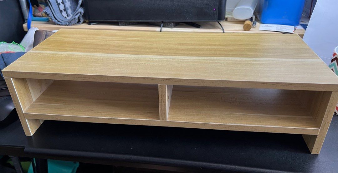 Wooden Monitor Stand - 50cm x 20cm x 13cm (Category: Other Accessories) located in Singapore. Submitted by 72xjgrk9zg (Listing ID 1373271521, Image 3). Description: - Wooden monitor stand - Excellent condition - Dimensions: 50cm (L) x 20cm (W) x 13cm (H) - Light brown color - Features two compartments - Helps organize your workspace.