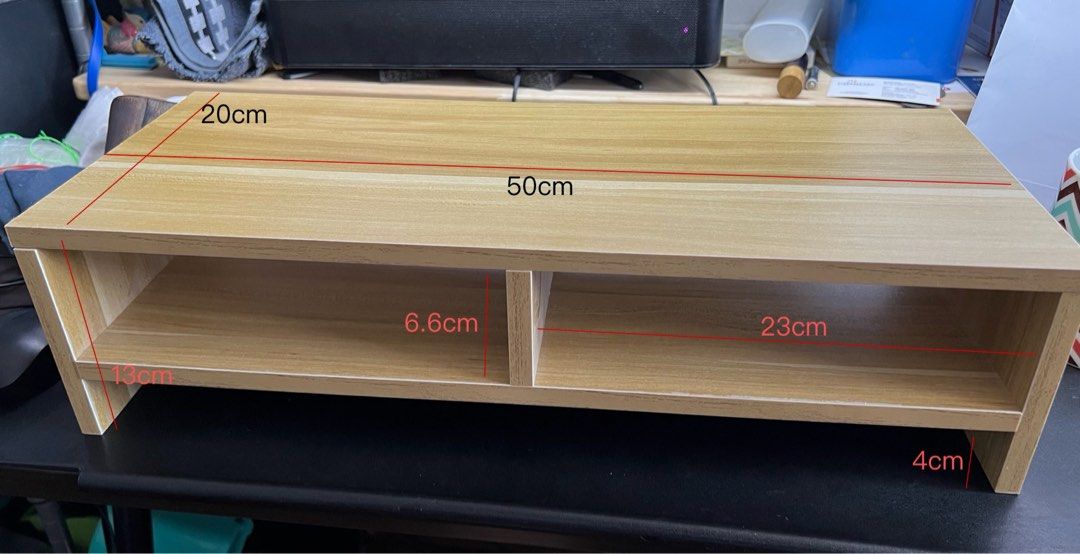 Wooden Monitor Stand - 50cm x 20cm x 13cm (Category: Other Accessories) located in Singapore. Submitted by 72xjgrk9zg (Listing ID 1373271521, Image 1). Description: - Wooden monitor stand - Excellent condition - Dimensions: 50cm (L) x 20cm (W) x 13cm (H) - Light brown color - Features two compartments - Helps organize your workspace.