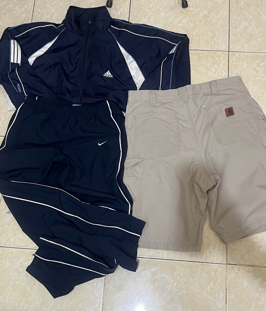 Carhartt x Y2k Nike (Category: Sets & Coordinates) located in San Leonardo. Submitted by kherwyn (Listing ID 1373321736, Image 1). Description: PLEASE READ THE DESCRIPTION FIRST Nike: Free size, 36w max Issue: need stitching sa pocket Carhartt: 34-36wx 22.5L issue: restitch back pocket Adidas Windbreaker(THIS COMES WITH THE NIKE IF BOUGHT) Size: 24x25 issue: zipper lost but still working DM YOUR OFFERS CAN BE SOLD ASPACK FIX 3500 IF ASPACK‼️‼️‼️ 