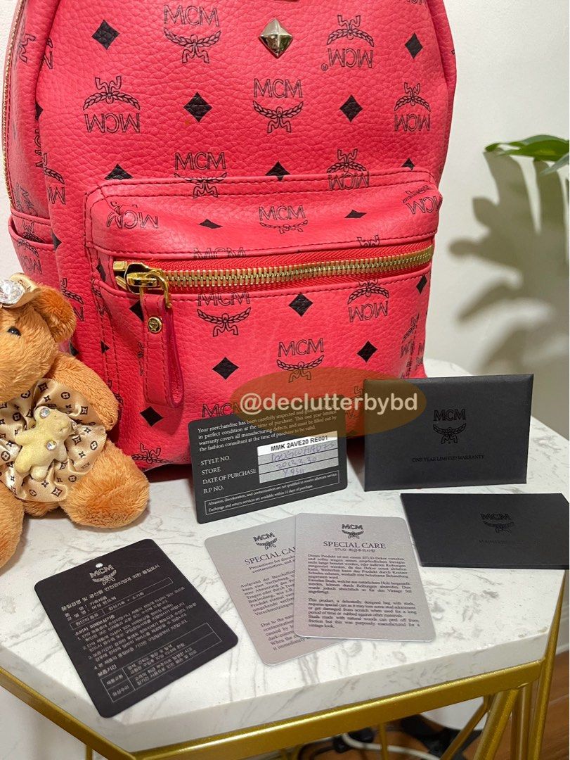 Authentic 💯 MCM Stark Pink Backpack Bag (with stud) (Category: Luxury Bags & Wallets) located in Quezon City. Submitted by declutterbybd (Listing ID 1373516434, Image 2). Description: 100% Authenticity Guaranteed! (Like New) Pre-loved. Used it twice only! On Hand! Bought directly in Korea. Money Back if proven fake (Big price markdown , really need to declutter) Item Details: *Model: MCM Stark Studded Backpack Bag *Color: Pinkish red *Size: Medi