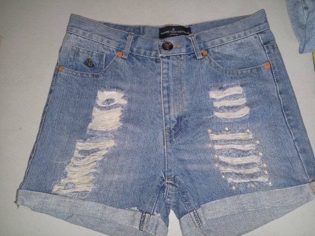 Authentic Vivienne Westwood Denim Shorts (Category: Shorts) located in Makati City. Submitted by costarlight (Listing ID 1373222308, Image 2). Description: Authentic Waist size 28 High Waist Negotiable Design: Icon button and embroidery details Ripped design; Pearl studs with strong metal attachment.