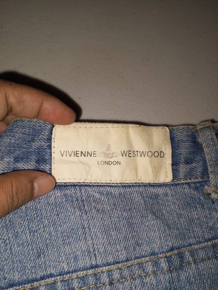 Authentic Vivienne Westwood Denim Shorts (Category: Shorts) located in Makati City. Submitted by costarlight (Listing ID 1373222308, Image 3). Description: Authentic Waist size 28 High Waist Negotiable Design: Icon button and embroidery details Ripped design; Pearl studs with strong metal attachment.