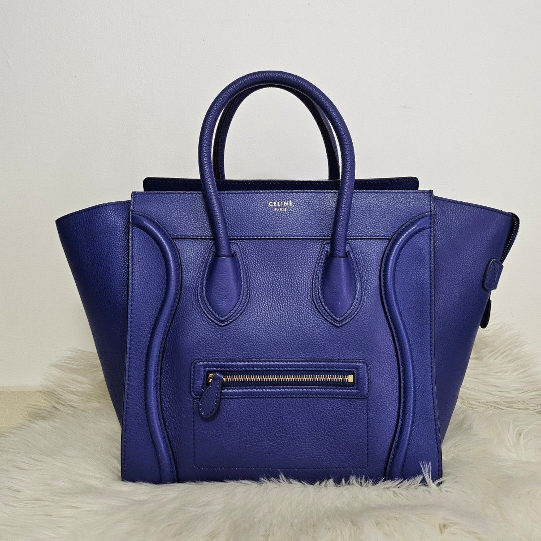 Celine Mini luggage in Coblat blue (Category: Bags & Wallets) located in Singapore. Submitted by shoe_lover (Listing ID 1244170495, Image 1). Description: 100% Authentic Excellent condition Bought from another Carousell seller Hardly used it - as good as new! Mini version - can fit MacBook Pro (14-inch) Slight stretch on one handle and bottom (not visible) Selling due to underutilized -Material: Leather -Colour: Coblat blue -Hardware: Gold -Inter