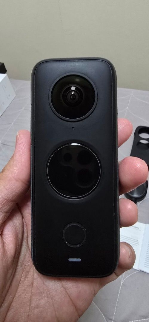 Insta360 ONE X2 (with Issue) (Category: Cameras) located in Las Pinas. Submitted by elenakrizzia (Listing ID 1373517054, Image 2). Description: ✨️LAST PRICE POSTED✨️ Package includes; * Unit ( Insta360 ONE X2 ) * Box * Stickers & Manuals * Bullet time cord * Sleeve * Lens cloth * Rubber unit protector * Replacement charging cord Issue: Scratch on back lens, May have affect taking photo on water on some angle. see last photo for back lens shots un
