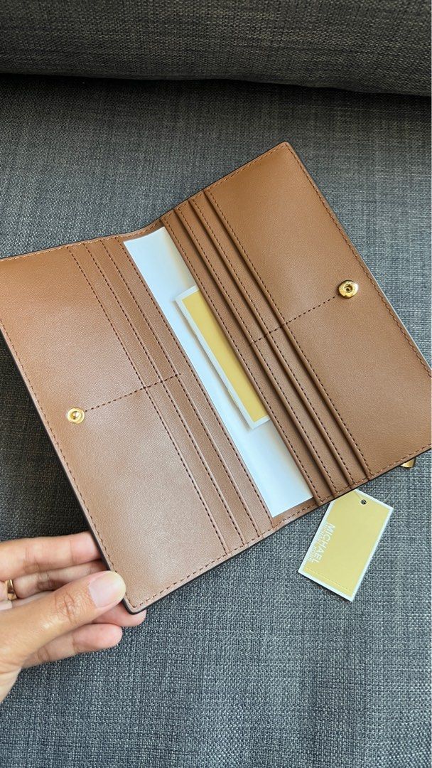 Michael Kors Reed Large Pebbled Leather Wallet (Brown) (Category: Wallets & Card holders) located in San Jose del Monte. Submitted by mishfcr (Listing ID 1373461126, Image 3). Description: Brand new and guaranteed authentic from the US 🇺🇸 MK Reed Large Pebble Leather Wallet in Brown Retails for $298 plus tax Selling for P2990 only • Pebbled leather • 100% leather • Gold-tone hardware • 7.5”W X 4”H X 0.75”D • Exterior details: back zip pocket • 