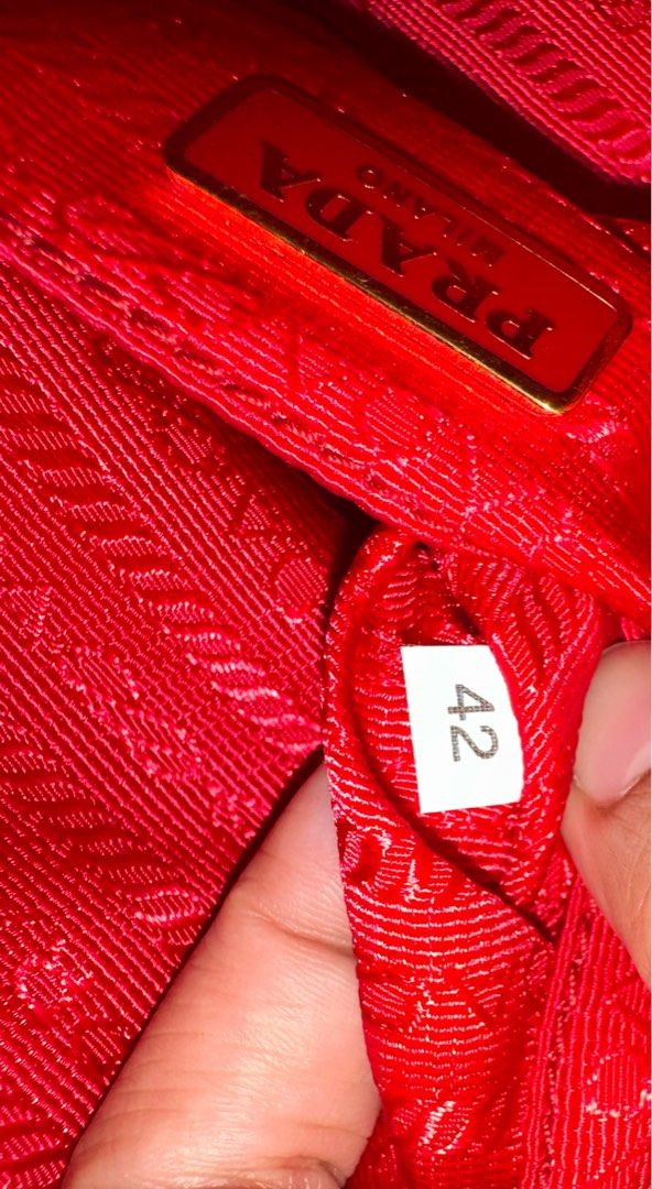 Prada Mini Camera Bag (Category: Luxury Bags & Wallets) located in Manila. Submitted by jslnd (Listing ID 1373503153, Image 3). Description: Vitello Daino Mini Camera Crossbody Rosso With Legit Grails Base length: 5.75 in Width: 2.00 in Height: 3.75 in NEGOTIABLE Ready to ship!.