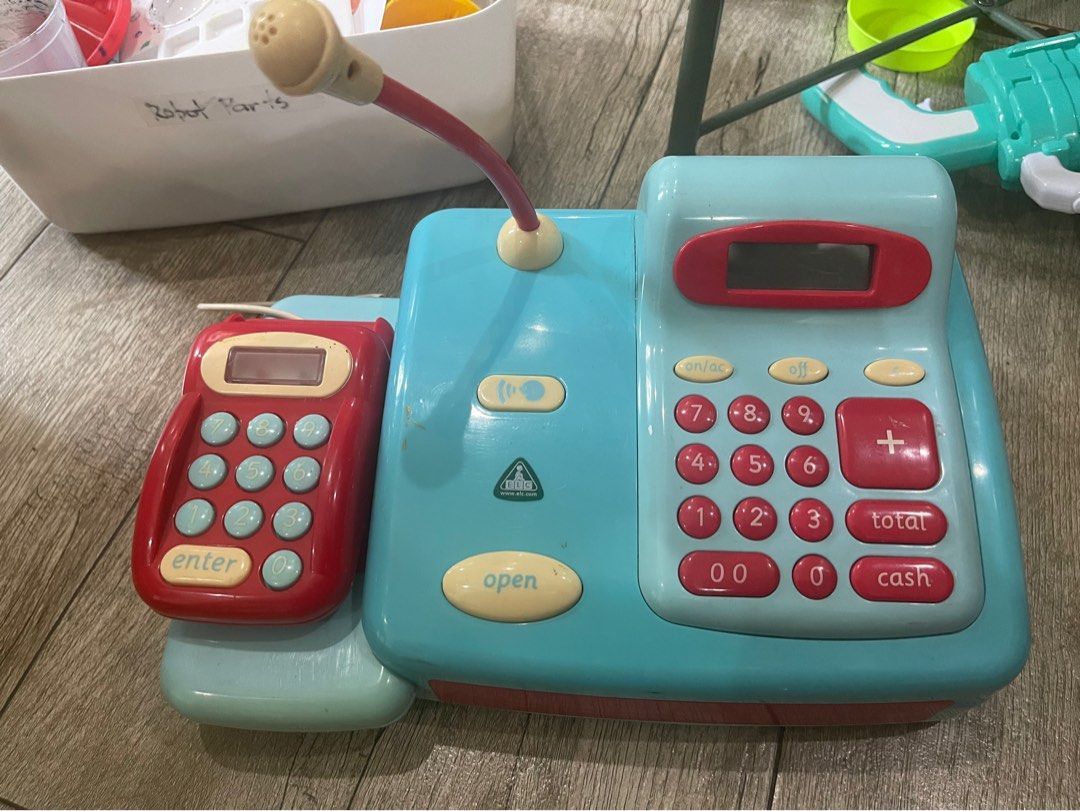 Cash Register Pretend Toy (Category: Educational & Learning Toys) located in Quezon City. Submitted by theygrowupsofast (Listing ID 1373597909, Image 1). Description: Battery operated and makes Ka-shing sounds, etc. Mic and calculator works too. A good way to make addition fun for little kids :) With free cut up paper bills 😆.