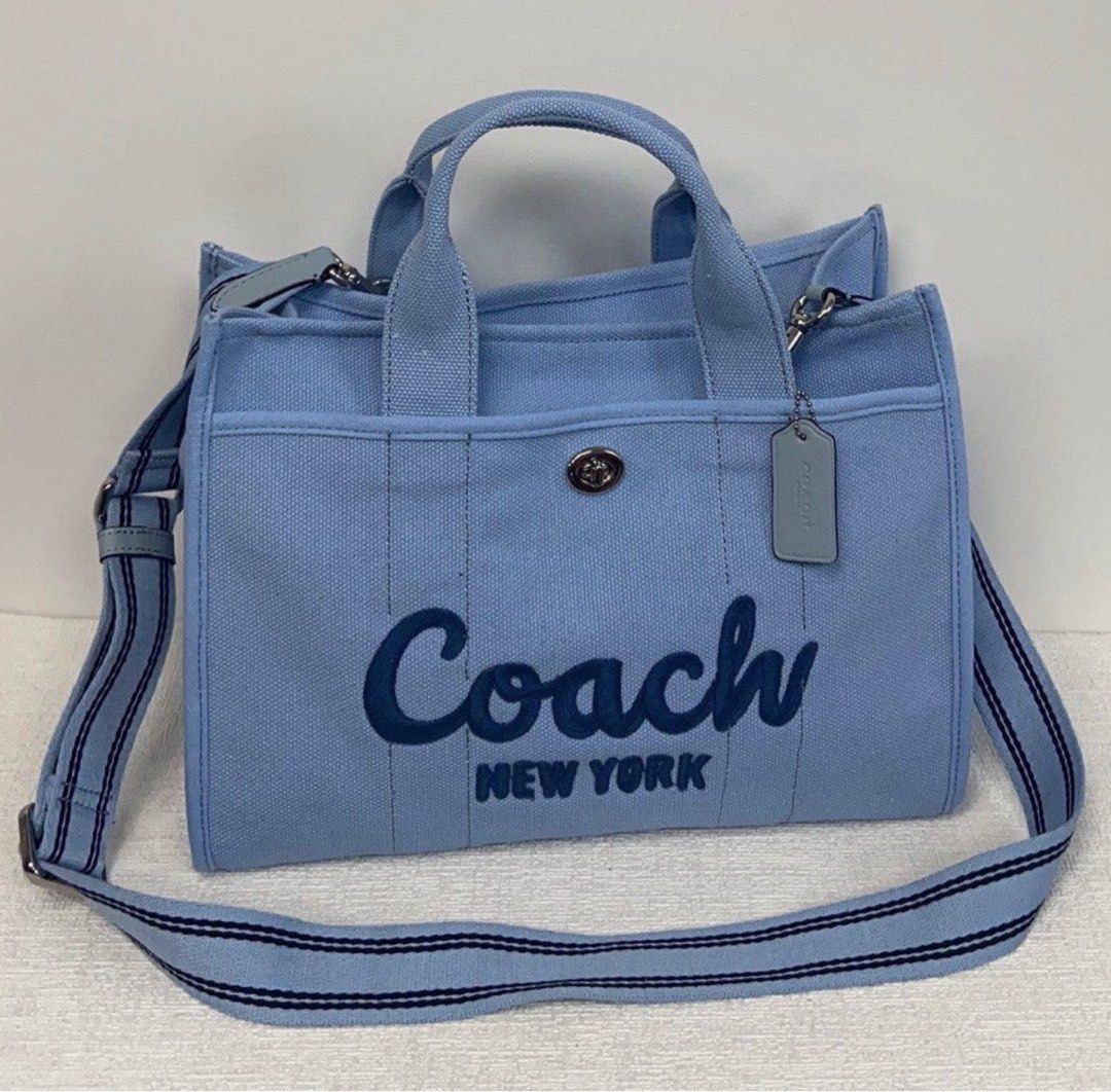 COACH Cargo 26 Canvas Tote Bag in Blue (Category: Luxury Bags & Wallets) located in Quezon City. Submitted by damarisxo (Listing ID 1373576236, Image 2). Description: Bought from a reseller on TikTok. Legit item from coach, not class A/oem. Actual photo posted on the last slide💙.