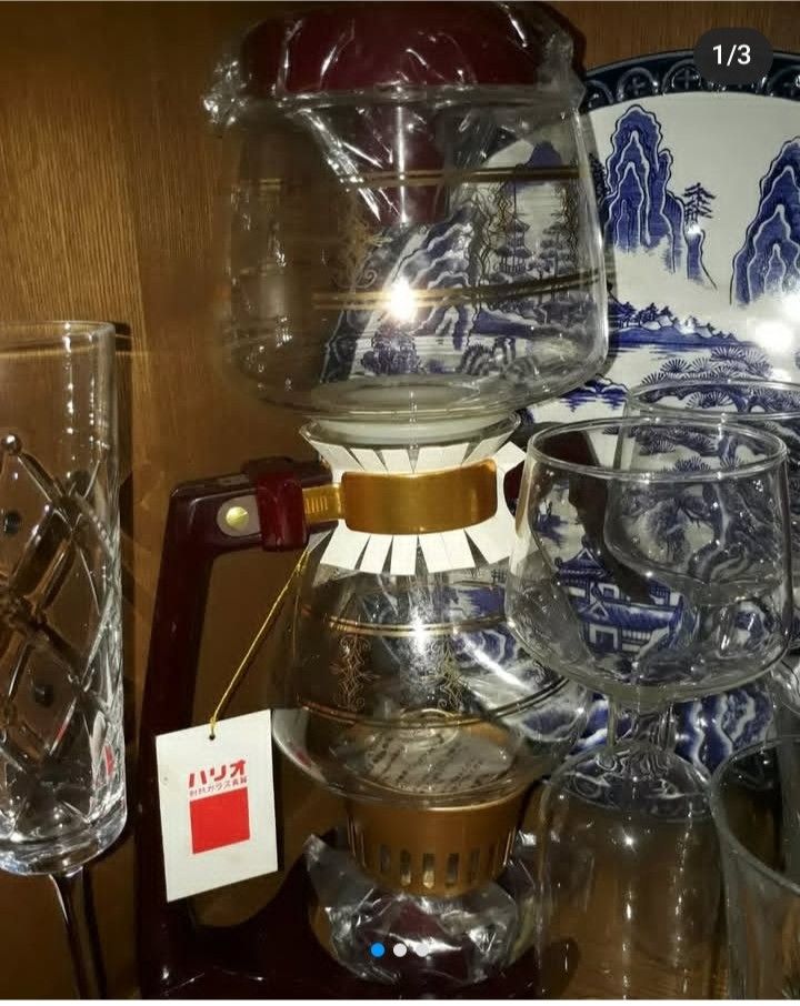 Glass Coffee Syphon Coffee Maker (Category: Coffee & Tea Tableware) located in Mandaluyong City. Submitted by ehrgeee (Listing ID 1373637790, Image 1). Description: Brand new without box. I already disposed the box since it is already deformed. Never been used. It has been stored inside the display cabinet. Complete with scoop accessories for coffee and tag. Made in Japan..