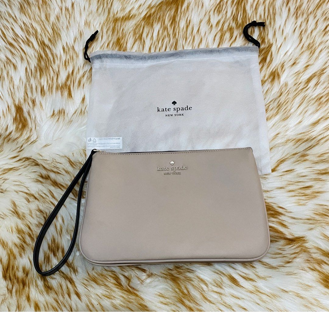 Kate spade beige chelsea medium wristlet (Category: Luxury Bags & Wallets) located in Manila. Submitted by sissymissy1527 (Listing ID 1373669154, Image 2). Description: Original Good as new Nylon Nasa 2,800 original price Kasya cellphone Twice used only Rfs: decluttering Loc: tandang sora, qc.