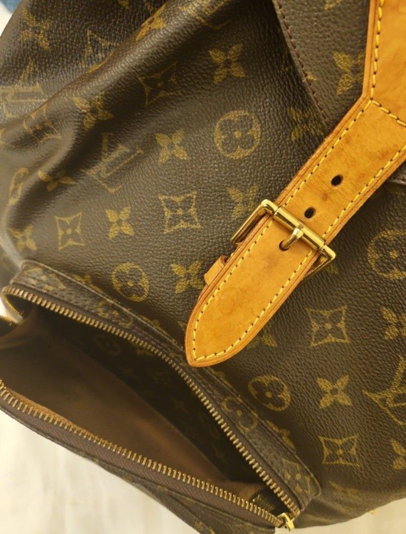 Louis vuitton vintage monogram bucket backpack (Category: Bags & Wallets) located in Singapore. Submitted by keeksell (Listing ID 1373681548, Image 3). Description: Nice patina in good condition aside from the drawstring broke (refer to last photo). if you send it to a bag spa they can replace it for you Height: 36cm, width 31cm depth 13cm.