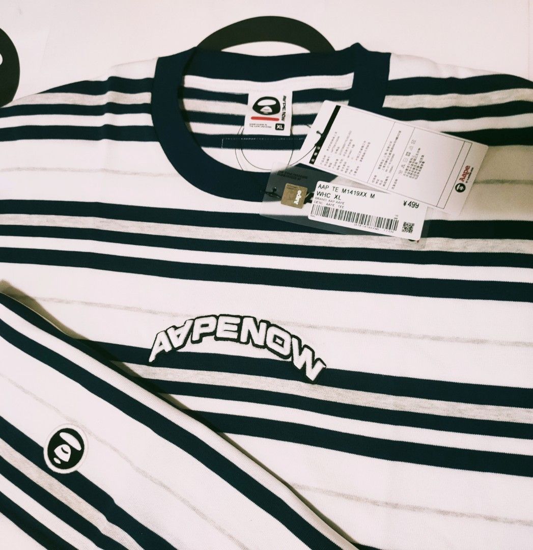 *NEAT* Aape BY *A BATHING APE® AAPE NOW Striped Tshirt White AAPTEM1419XXMWHC (Category: Tshirts & Polo Shirts) located in Singapore. Submitted by nofrillsfactoryoutlet (Listing ID 1373683321, Image 9). Description: Usual : $115 SALE : $93 100% Authentic and Brand New with Tags and packaging. Direct from Aape BY *A BATHING APE® outlet in Beijing. Brand : Aape BY *A BATHING APE® Series : AAPE NOW Design : Striped Tshirt Colour : White / Multicolou