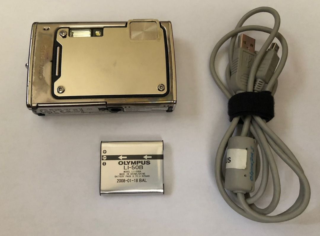 Olympus 1030 SW Digital Camera Digicam (Category: Cameras) located in Arayat. Submitted by josepdg (Listing ID 1373668724, Image 2). Description: 10MP CCD Digital Camera. What's Included; -Camera -Olympus Li-50B Battery (used) -USB Cable for photo transfer ISSUES; -XD card slot is non-functional. The camera has a built in 15MB of storage which can store ~30 photos at 2MP res, or around ~160 at the lowest vga resolution. A USB cable is included to