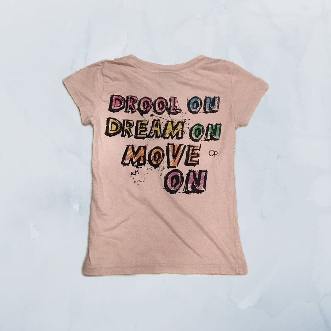 Pink T-shirt (Category: Babies & Kids Fashion) located in Singapore. Submitted by bellezapparel (Listing ID 1373665052, Image 2). Description: The size is 6/7, shirt is in good condition other than small stain at the bottom 📮mailing is available for $3.