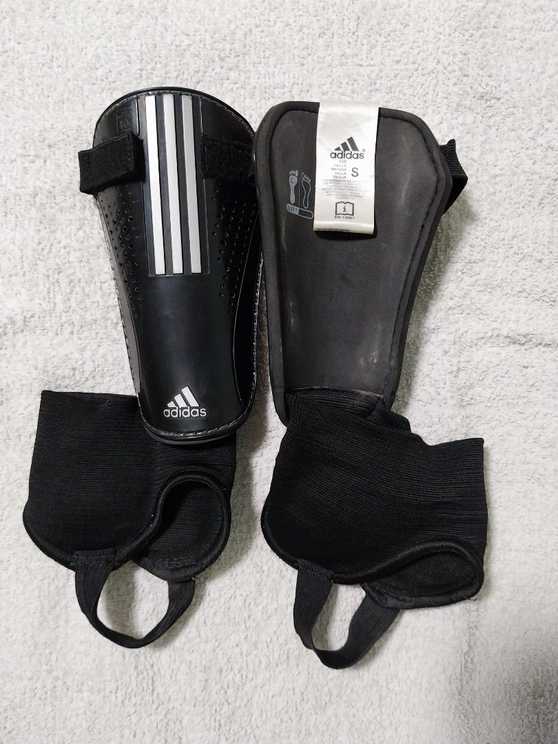 Soccer Shoes with shin guards (Category: Babies & Kids Fashion) located in Paranaque City. Submitted by shellatan21 (Listing ID 1373599854, Image 2). Description: shoe size 1.5 UK (2 US); includes 2 pairs of Adidas shin guards.