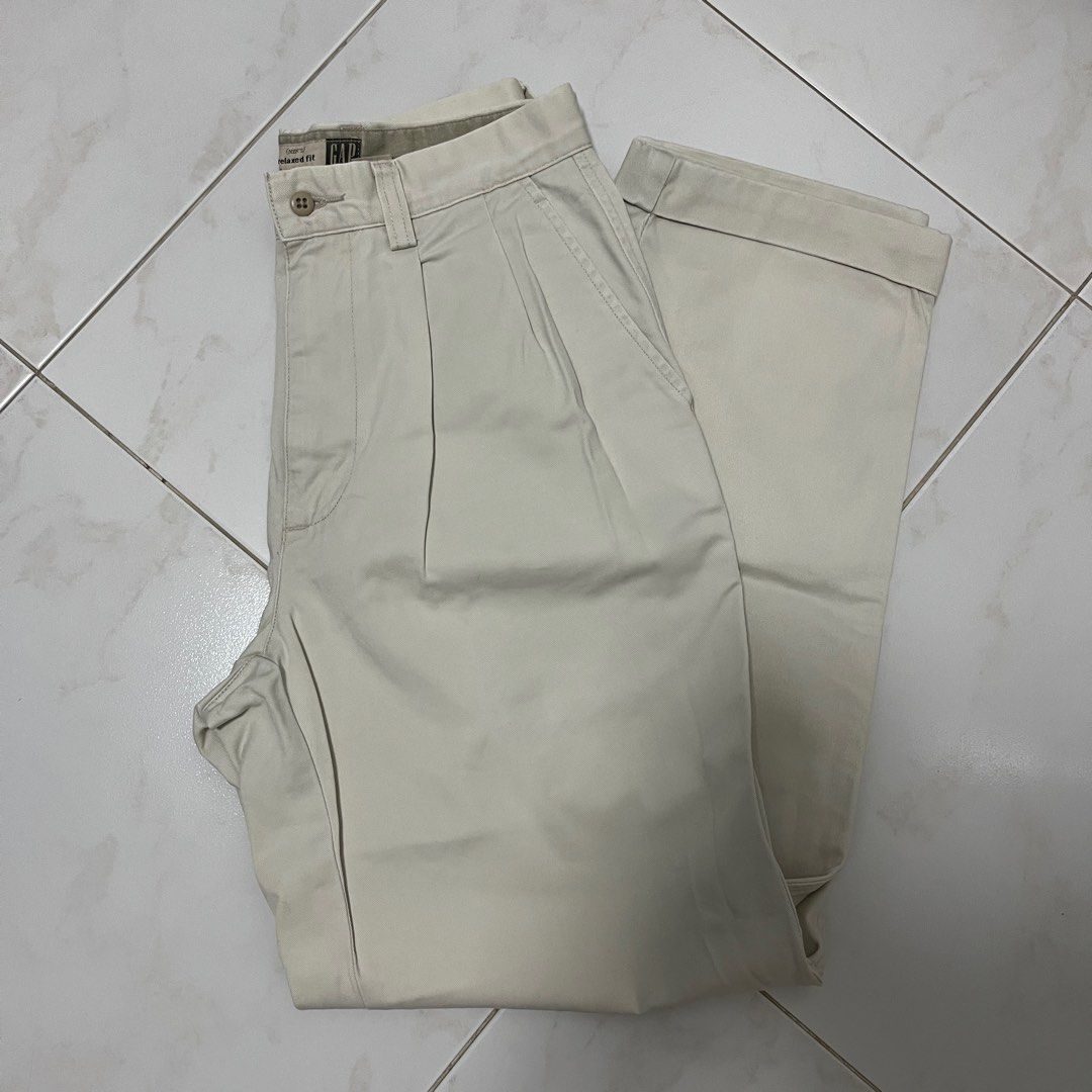 Vintage GAP Cream Pleated front pants (Category: Trousers) located in Singapore. Submitted by comfyclub (Listing ID 1373704142, Image 1). Description: • Unisex item • Measurements: - Waist: 27” - Length: 40” - Inseam: 29.5” • take note that the bottom cuffs are sewn in, so it’ll look like your pants are folded • no tears or holes, but some slight yellowing here and there 📦 FREE MAILING with tracking number 🧍 meetups only at my convi / extra cha