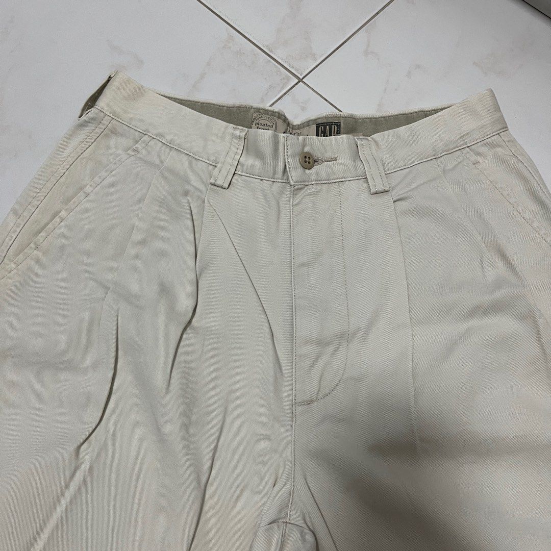 Vintage GAP Cream Pleated front pants (Category: Trousers) located in Singapore. Submitted by comfyclub (Listing ID 1373704142, Image 2). Description: • Unisex item • Measurements: - Waist: 27” - Length: 40” - Inseam: 29.5” • take note that the bottom cuffs are sewn in, so it’ll look like your pants are folded • no tears or holes, but some slight yellowing here and there 📦 FREE MAILING with tracking number 🧍 meetups only at my convi / extra cha