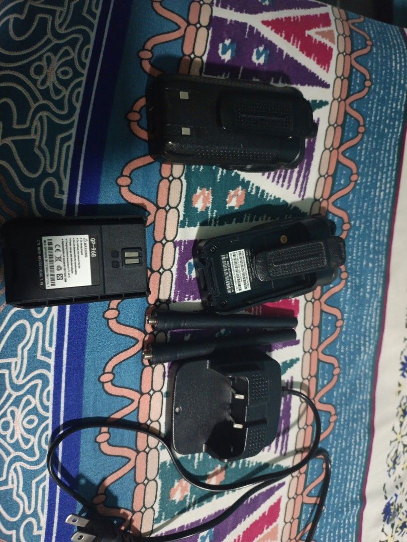 Walkie talkie (Category: Walkie-Talkie) located in Singapore. Submitted by anlif (Listing ID 1373748325, Image 2). Description: I used it a couple of time. my friend lost its charging dock but it uses USB. one of the belt clips have broken off but I used glue. I do not know the model or the name of this radio as I have went to both Motorola and baofeng but it does not exist. trade or sell either way I need this off my hands and still able to use.