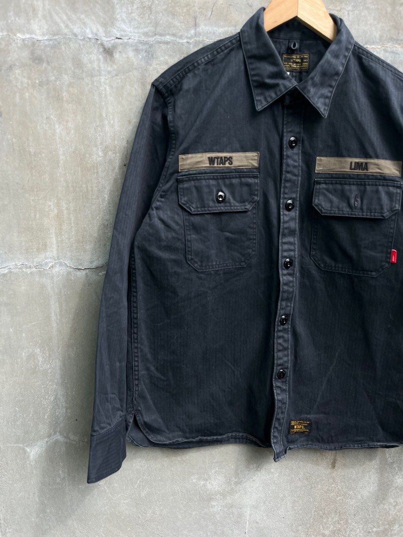 Wtaps Lima Buds Overshirt Jacket (Category: Activewear) located in Baguio. Submitted by lordeidara (Listing ID 1373752140, Image 2). Description: 8/10 Minor fading Color:Dark Navy Blue Material: cotton Size on tag:3 Fits: Length: 28.5 Width: 23 Sleeve Length: 24.5 Shoulder to shoulder: 18 Hem:20.5.