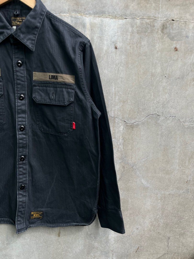 Wtaps Lima Buds Overshirt Jacket (Category: Activewear) located in Baguio. Submitted by lordeidara (Listing ID 1373752140, Image 3). Description: 8/10 Minor fading Color:Dark Navy Blue Material: cotton Size on tag:3 Fits: Length: 28.5 Width: 23 Sleeve Length: 24.5 Shoulder to shoulder: 18 Hem:20.5.