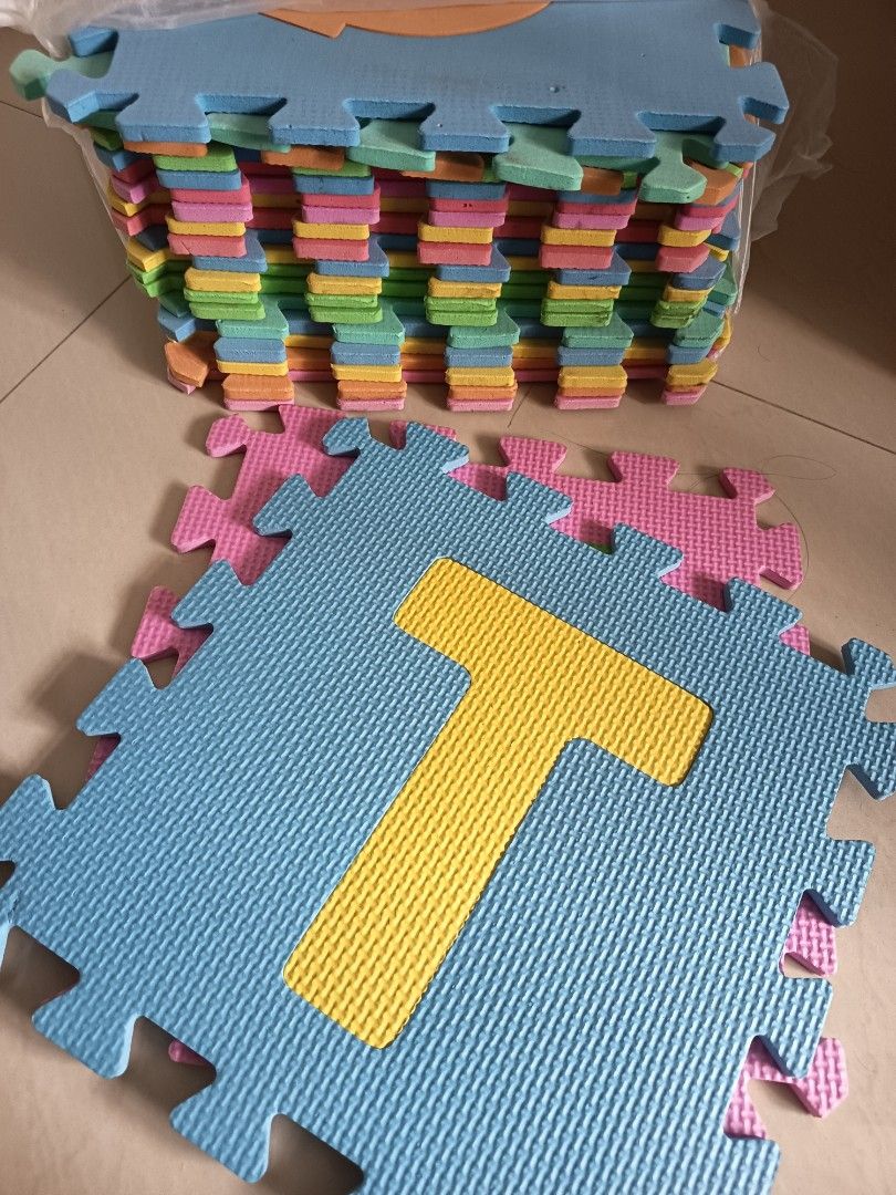 Alphabet Foam Puzzle Mat set (Category: Infant Playtime) located in Singapore. Submitted by lobang188 (Listing ID 1373782599, Image 1). Description: This is a foam puzzle mat with mamy letters colours. It's a great way to teach your little ones the alphabet while they play. The mat is made of soft, durable foam and is easy to clean. It's perfect for use in playrooms, nurseries, or any other area where kids play. The mat is in good condition and h