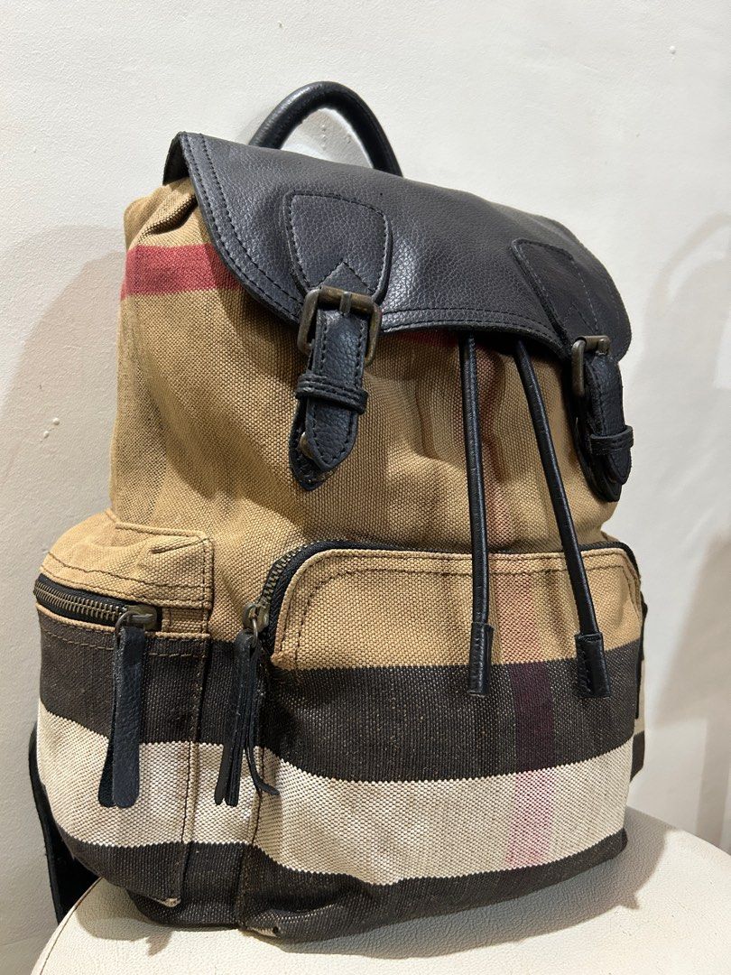 BURBERRY The Rucksack Heavy Canvas Backpack (Category: Luxury Bags & Wallets) located in Cagayan de Oro. Submitted by oracle_archives (Listing ID 1373916300, Image 2). Description: Vintage BURBERRY The Rucksack Heavy Canvas Backpack Distressing, rust on hardware sign of usage overall rate 8/10.
