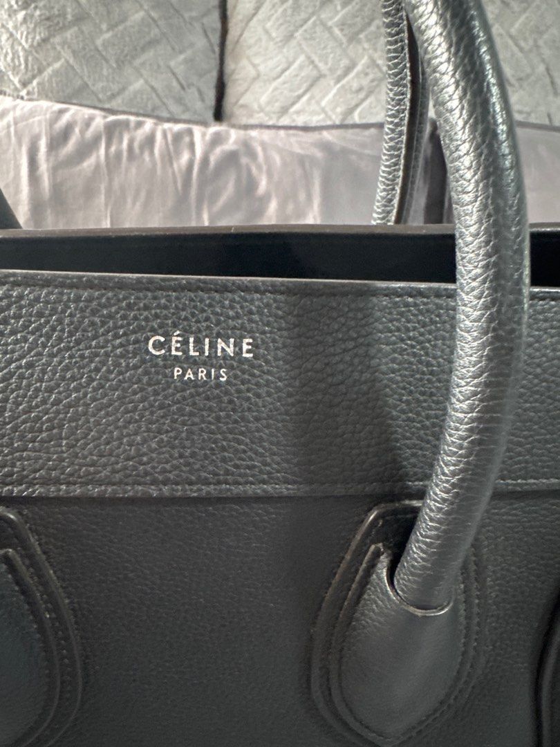 Celine Mini Luggage Black (Category: Bags & Wallets) located in Singapore. Submitted by just_watching (Listing ID 1373801181, Image 2). Description: Black celine Mini. Able to carry laptop. Wonderful drum leather. Great bag. Structure still great. Spacious bag. Scuff on the bottom end as in picture. Not visible when carrying as it is near the bottom. Great price . .