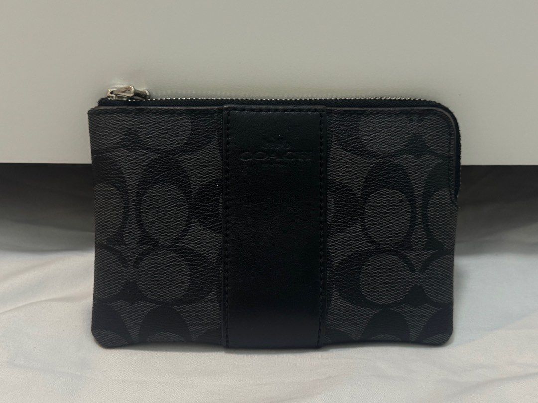 Coach Signature Canvas Leather Wristlet (Category: Luxury Bags & Wallets) located in Cavite. Submitted by mocksteals (Listing ID 1373856043, Image 3). Description: - Original from the US - Wristlet strap is missing - Used as a coin purse but wasn’t used much - Has minor flaws - With Card Slots - Highly negotiable .