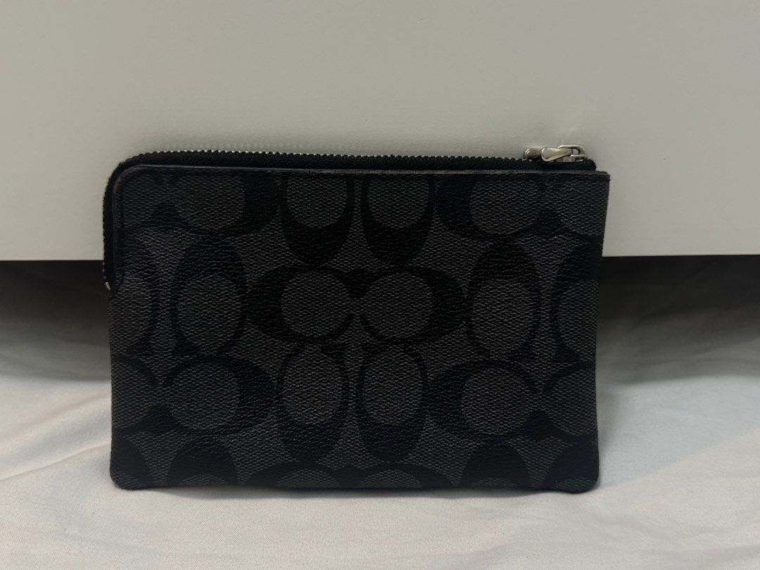 Coach Signature Canvas Leather Wristlet (Category: Luxury Bags & Wallets) located in Cavite. Submitted by mocksteals (Listing ID 1373856043, Image 2). Description: - Original from the US - Wristlet strap is missing - Used as a coin purse but wasn’t used much - Has minor flaws - With Card Slots - Highly negotiable .