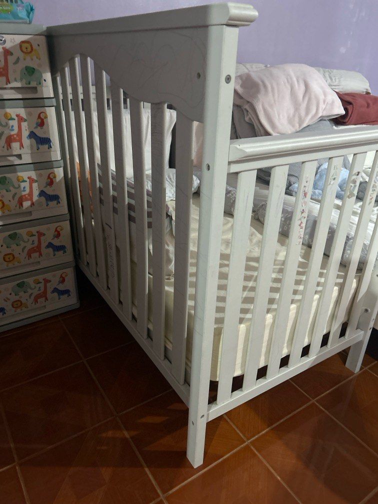 Cuddle bug crib (Category: Cots & Cribs) located in Manila. Submitted by warnerjason.co (Listing ID 1373926867, Image 2). Description: - with matress - bottle holder - can be used as a crib or co sleeper - lightly used as our daughter does not want to sleep on it. - with drawings and stickers on it as played with by a toddler but can be painted - buyer to arrange transport or delivery - still in good and very safe condition.