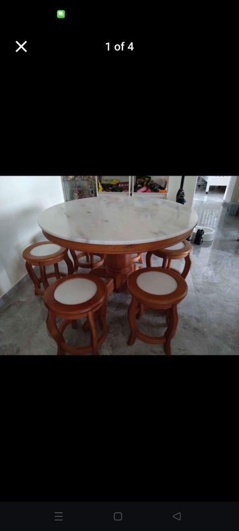Dining Table Set (Category: Tables & Sets) located in Singapore. Submitted by kh2square (Listing ID 1373846238, Image 1). Description: Round Marble Dining Table (3.5Ft) + 5 Stools Set Description - Natural Marble - Solid Mahogany Wood - Smooth Rounded Table Edge - Available in Natural Mahogany Wood Colour Dimensions Table Top Dimensions 3.5 Ft - 106.7cm x 106.7cm Chairs width: 35.6 cm Height from ground to chair seat: 45.7cm.