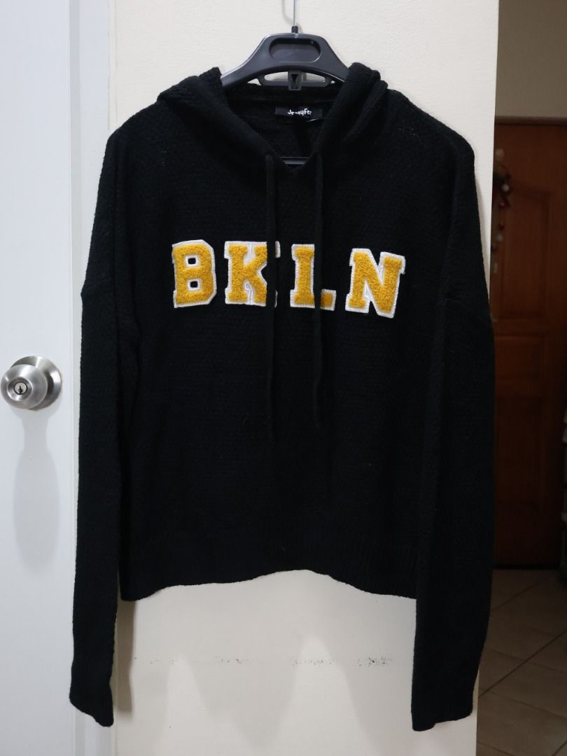 JENNYFER Black BKLYN Hoodie (Category: Coats, Jackets and Outerwear) located in Manila. Submitted by coldchai (Listing ID 1373830907, Image 3). Description: Brand: Jennyfer (Authentic) Color: Black with yellow & white fleece cotton letters Material: Soft fleece texture – warm and comfy. Great for layering during the -ber months or travel PM for more inquiries. Pay first then, pick-up and delivery!.